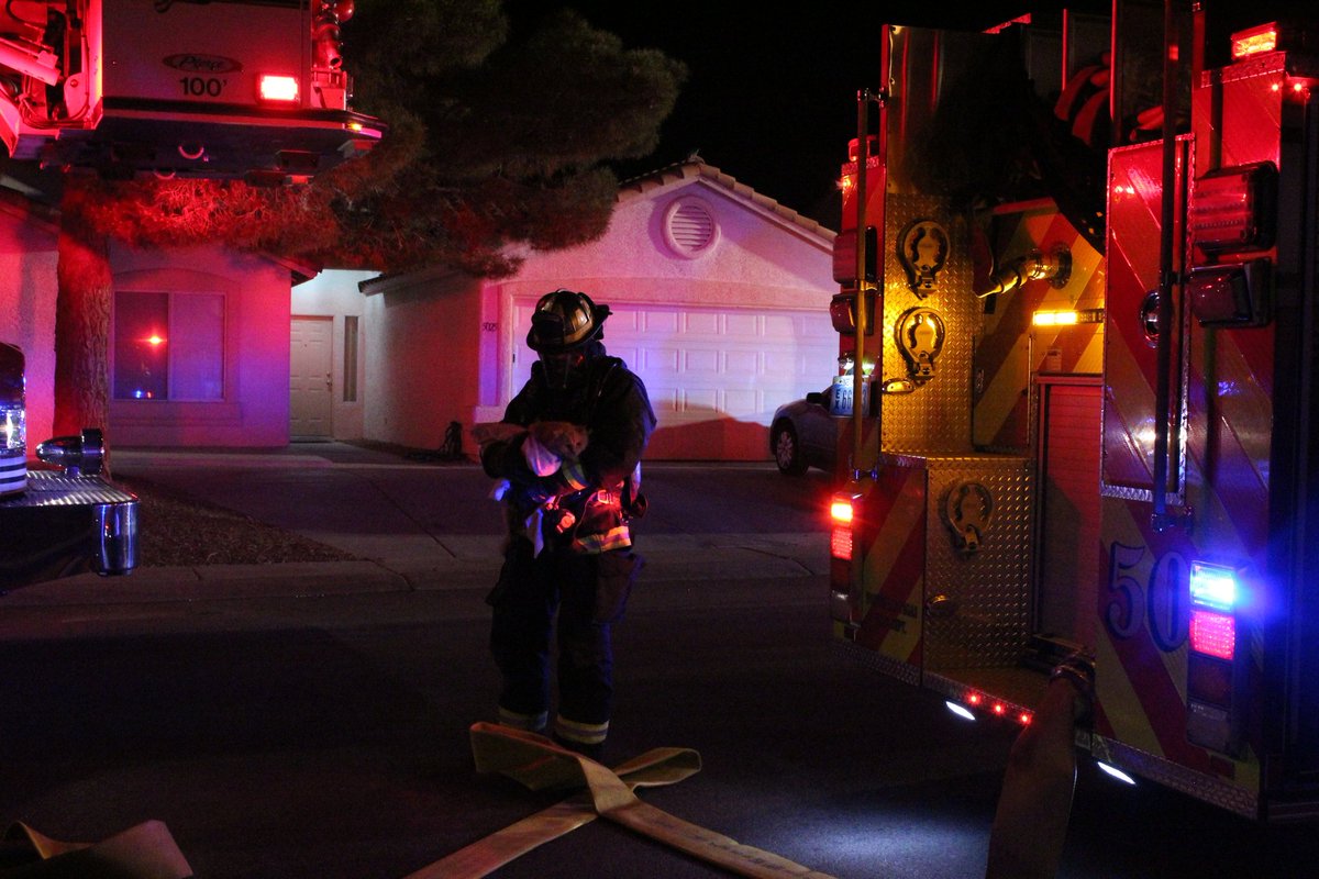 North Las Vegas firefighters responding to a home near Washburn and Commerce. Two firefighters carried a cat and small dog out of the house, unclear if residents were injured