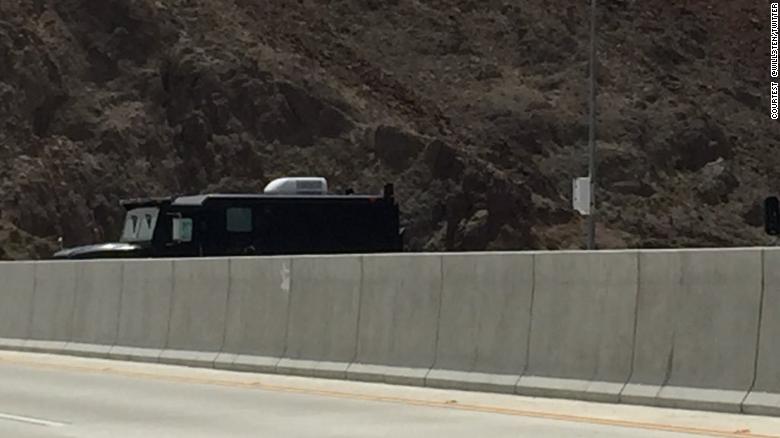 An armed man  blocked a highway near the Hoover Dam with an armored truck on Friday and demanded the release of the Justice Department's internal report on the Hillary Clinton email probe, which had already been released.    
