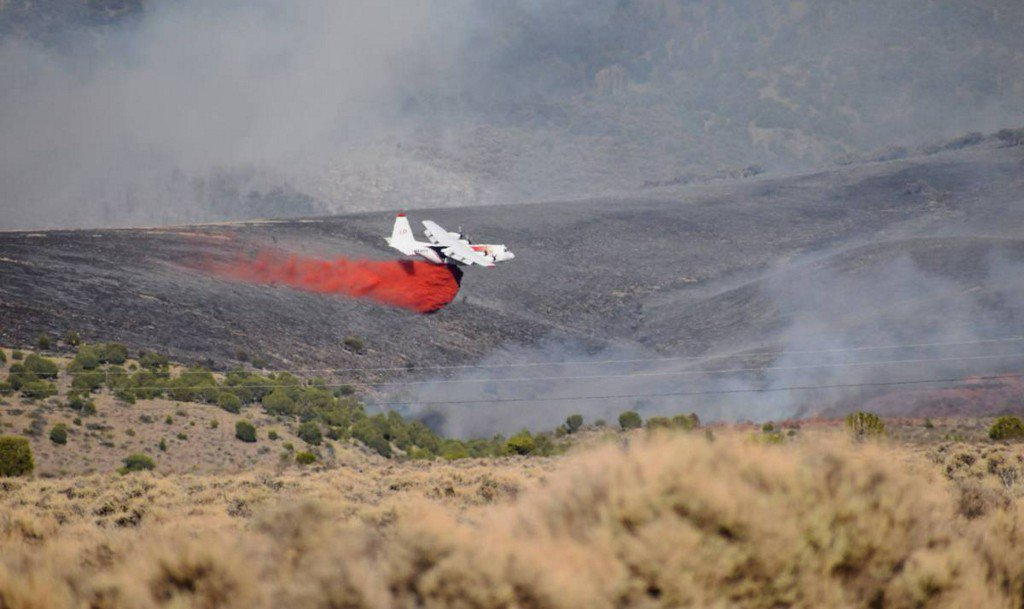 Crews battled a fire that had reached 350 acres Tuesday night near Ely, Nevada.