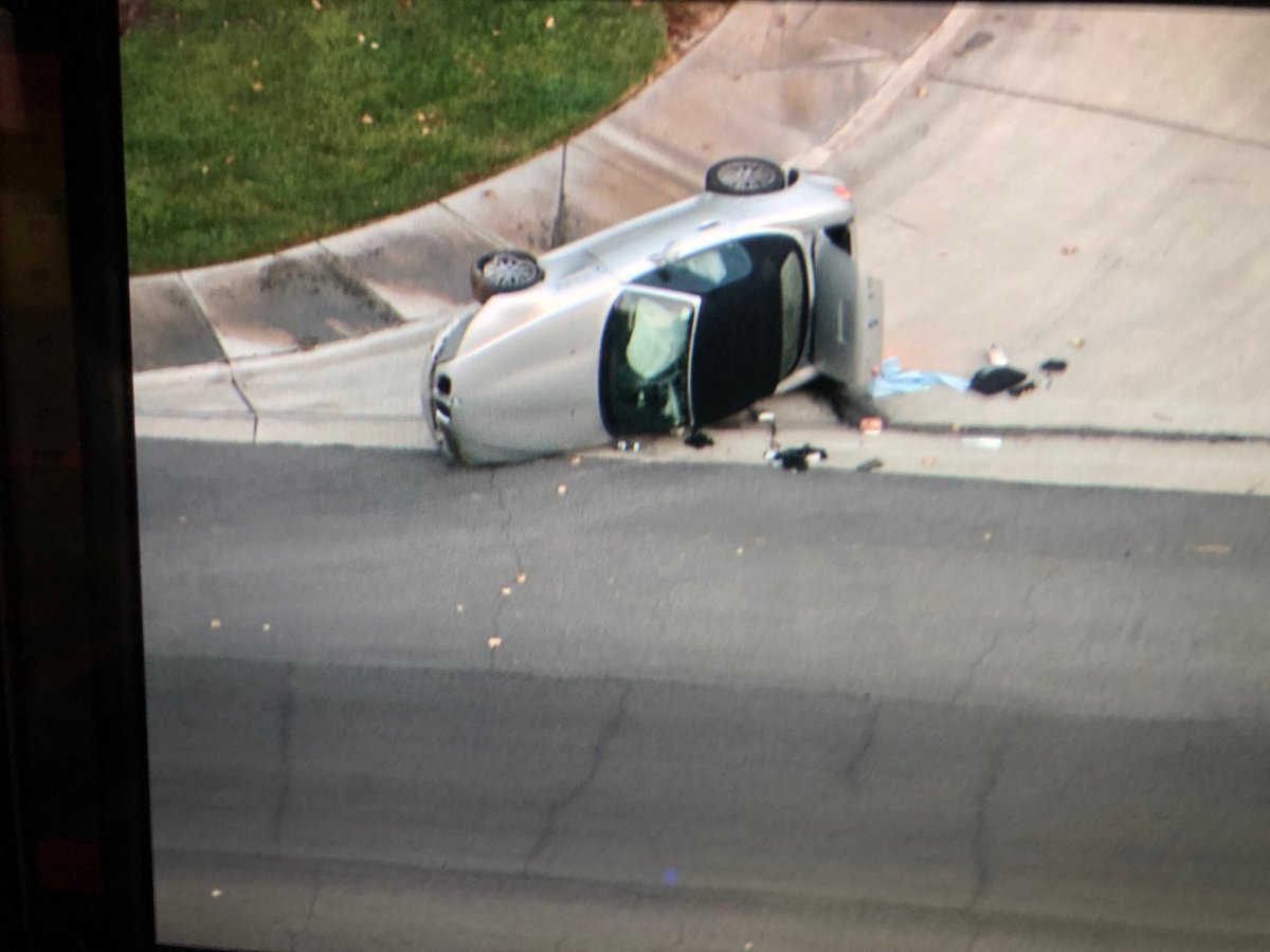 Rollover crash on Lake North near Grand Canyon. Driver looked to be out of the car and sitting up.