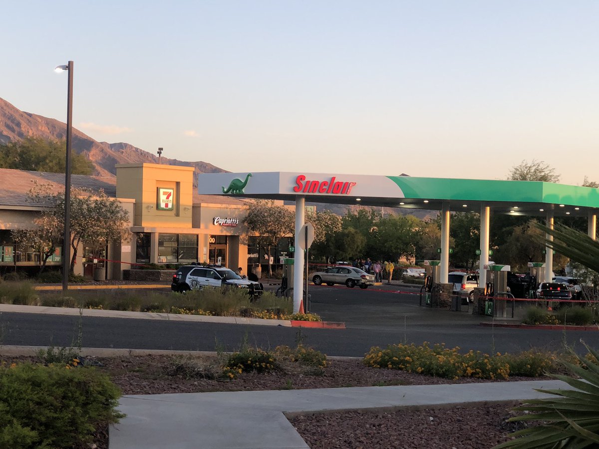 At 711 near Town Center and Covington. Police say they located 2 suspects connected with armed robberies parked here. Police say male suspect pulled out gun, that's when officers fired. One man and one woman taken to UMC, in stable condition