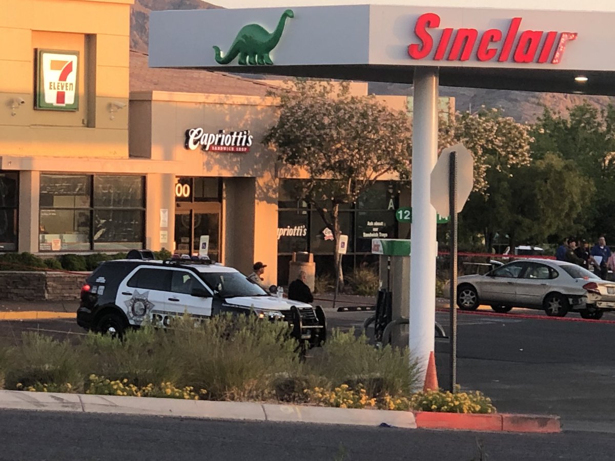 At 711 near Town Center and Covington. Police say they located 2 suspects connected with armed robberies parked here. Police say male suspect pulled out gun, that's when officers fired. One man and one woman taken to UMC, in stable condition