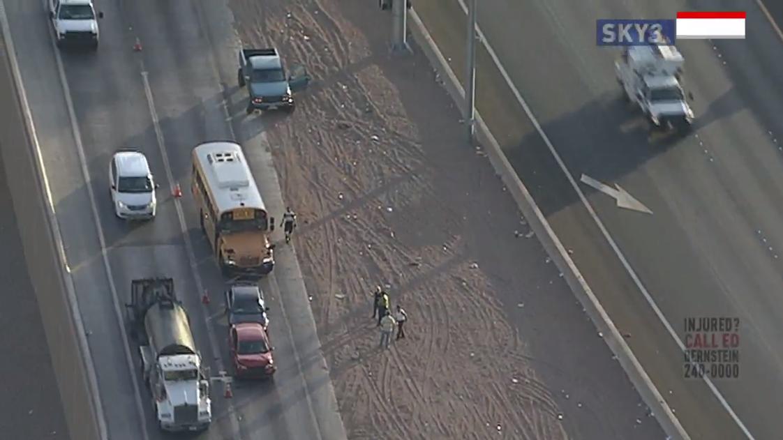 A crash involving a school bus is clogging a connector ramp on the Spaghetti Bowl in Las Vegas
