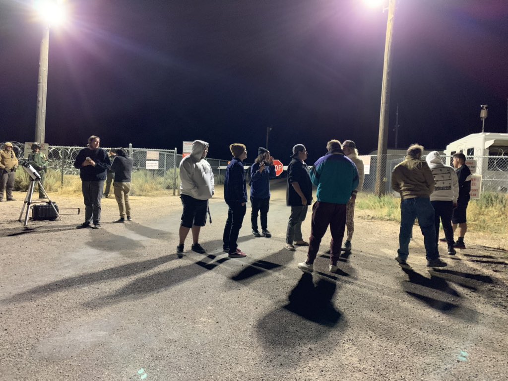 A group of people and law enforcement at the back gate of Area 51 near 3 am. #area51 #StormArea51