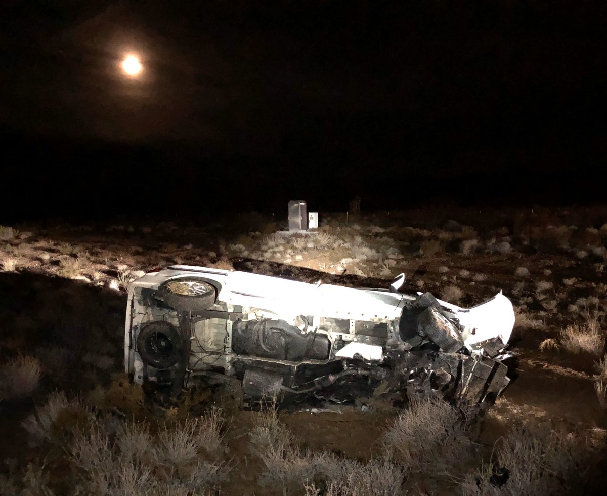 The silver car is the wrong-way driver and van in the desert is the right-way driver.  