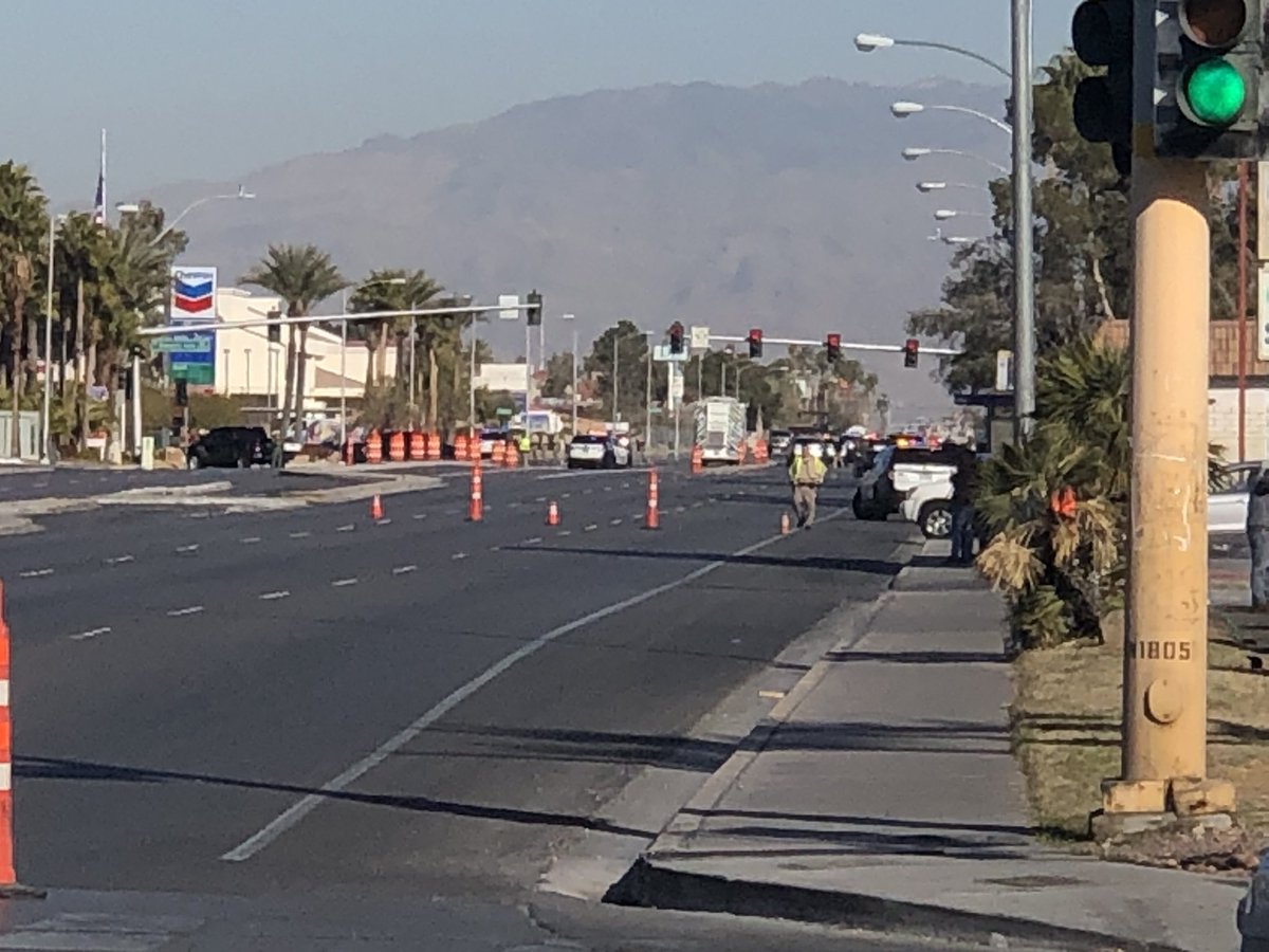 Rainbow closed between Spring Mountain and DI after officer-involved shooting. Police say suspect is not in custody & is barricaded.
