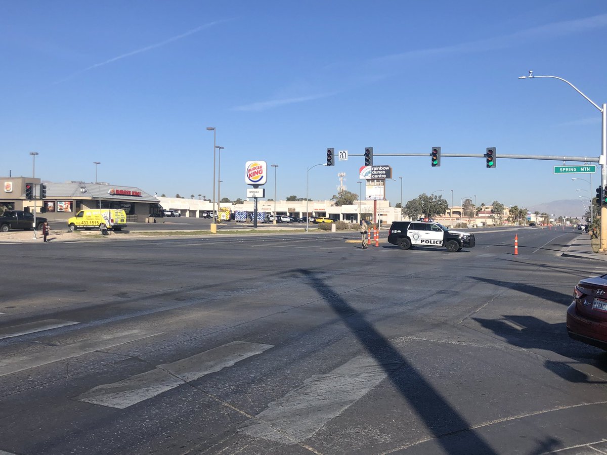 Rainbow closed between Spring Mountain and DI after officer-involved shooting. Police say suspect is not in custody & is barricaded.