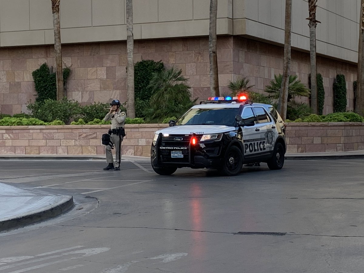 There is at least one @LVMPD vehicle parked in front of the Nordstrom's across the street from @TrumpLasVegas. They have put on helmets. Looks like a small group of people is starting to gather here as well. @8NewsNow 