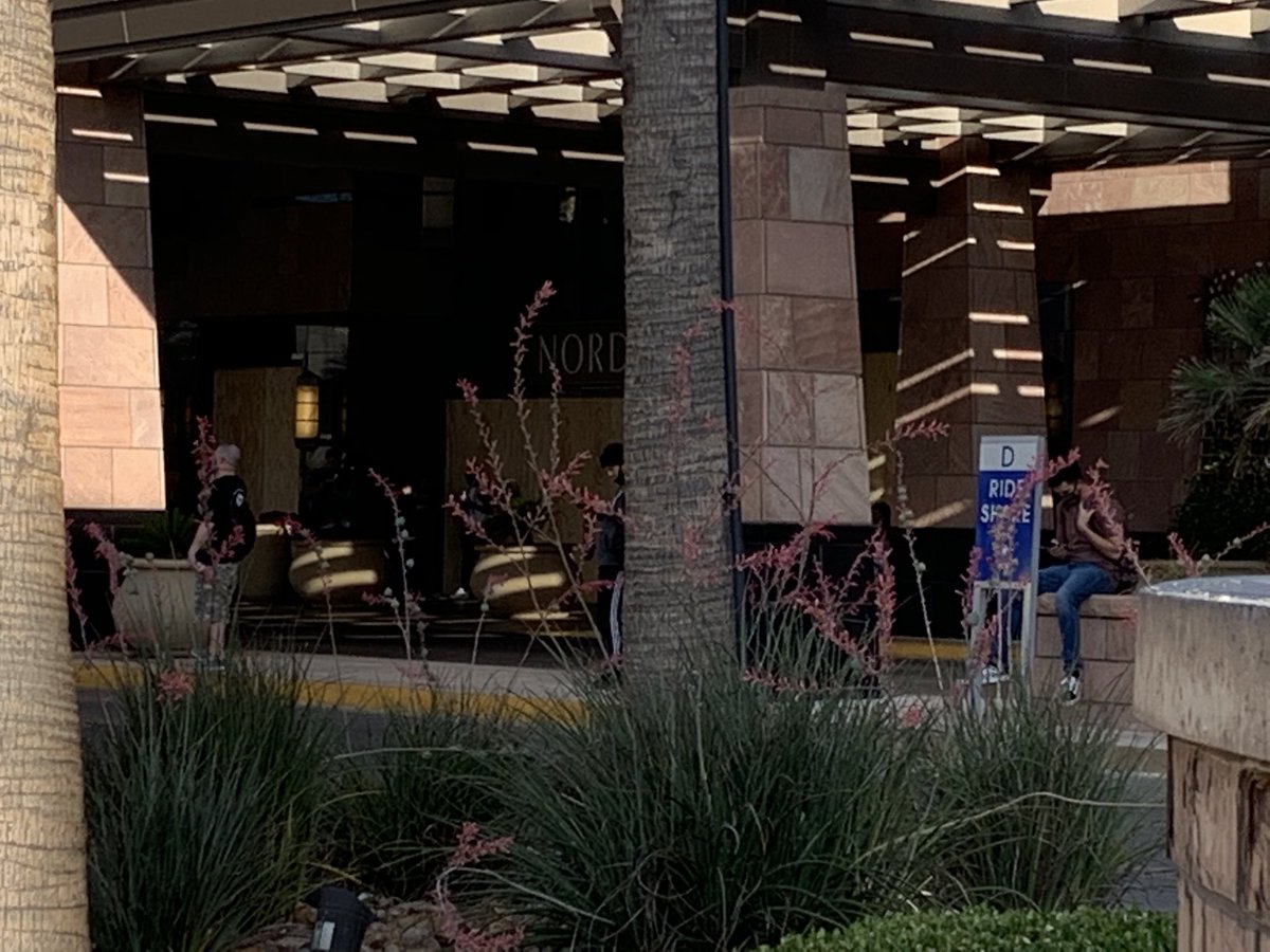 There is at least one @LVMPD vehicle parked in front of the Nordstrom's across the street from @TrumpLasVegas. They have put on helmets. Looks like a small group of people is starting to gather here as well. @8NewsNow 