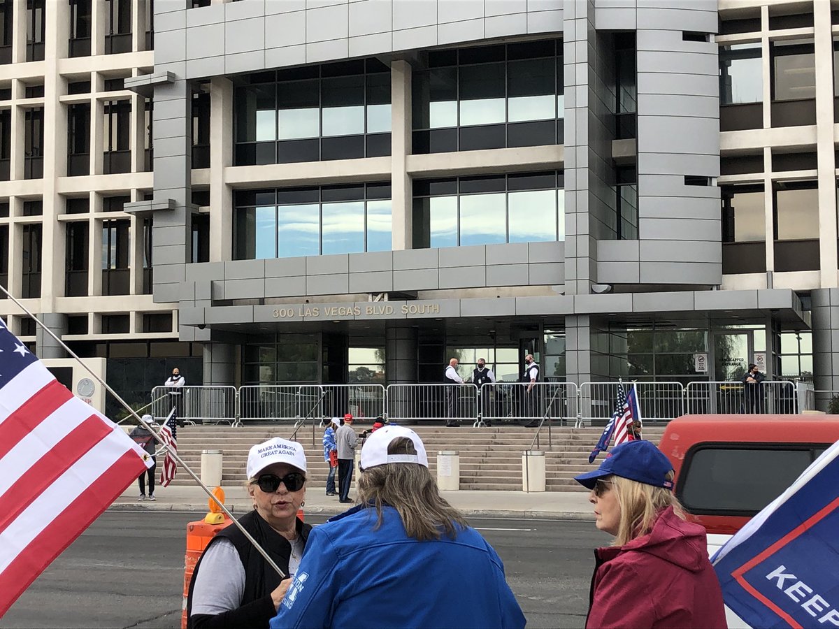 About 100 people outside here at the Foley Federal Building. Gates and security guards near entrance.  People say they are protesting the election results. Here's what some had to say about what's happening at the capitol: 1)a few condemned the violence while supporting the cause