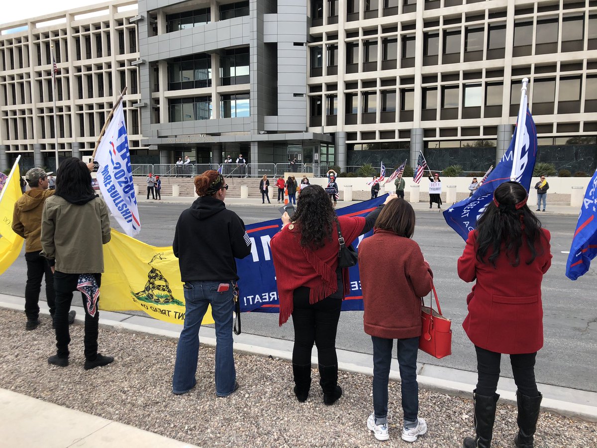 About 100 people outside here at the Foley Federal Building. Gates and security guards near entrance.  People say they are protesting the election results. Here's what some had to say about what's happening at the capitol: 1)a few condemned the violence while supporting the cause