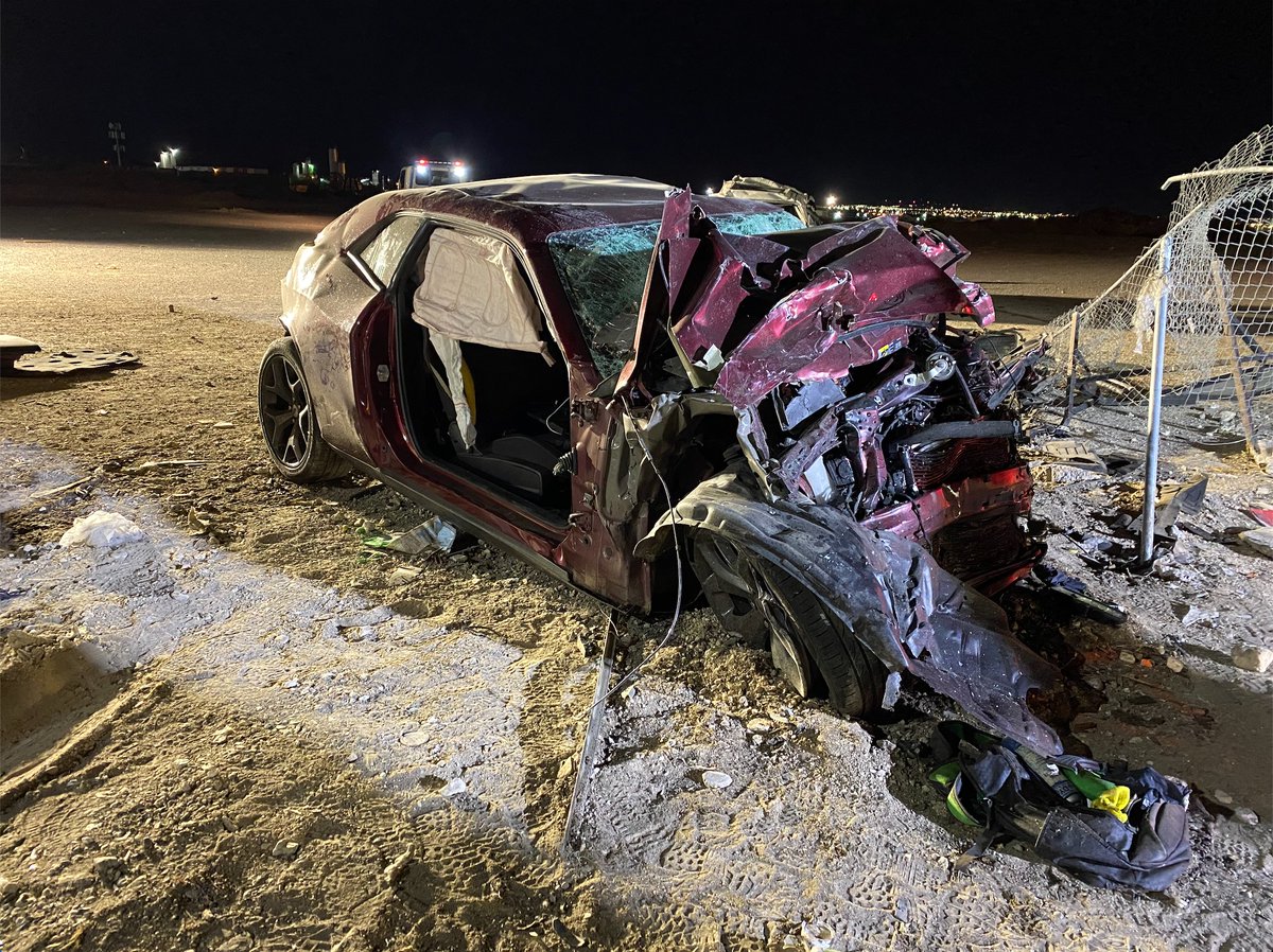 Photos from @NLVPD show the damage caused by the impact. The white van held the 7 passengers who died, and the red Challenger was the speeding car holding two people who died. A 10th is in critical condition at UMC. 15 people and 6 cars total were involved