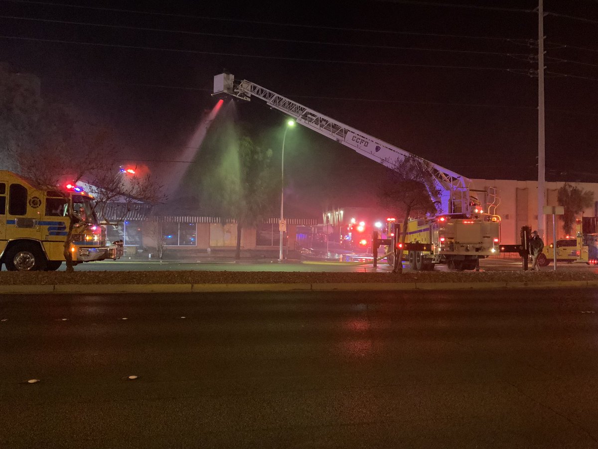 Fire is mostly OUT, hotspots remain, crews working on them. Cause U/I, no injuries, bldg completely destroyed, last large fire Jan 18, crews picking up, 800 E Sahara Ave Statewide Lighting Center, TOC:1:55pm, mostly @ClarkCountyFD on scene, this in @CityOfLasVegas