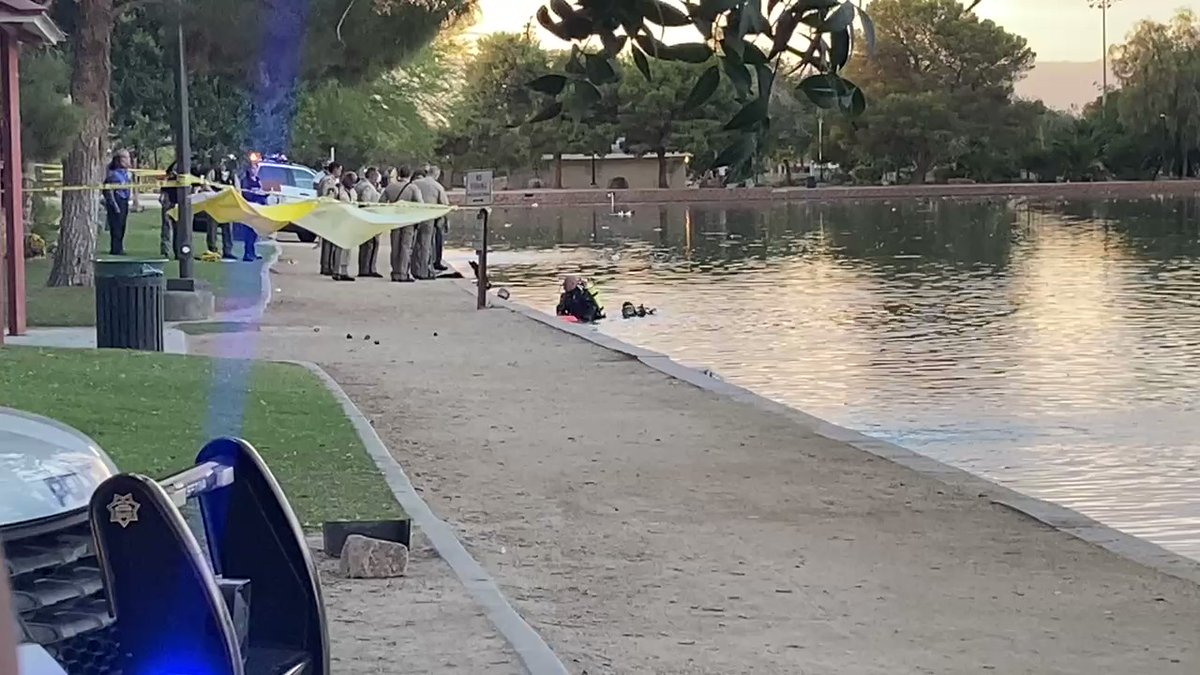 LVMPD investigating a drowning at the lake at Sunset Park. Saw a body being pulled out by police divers