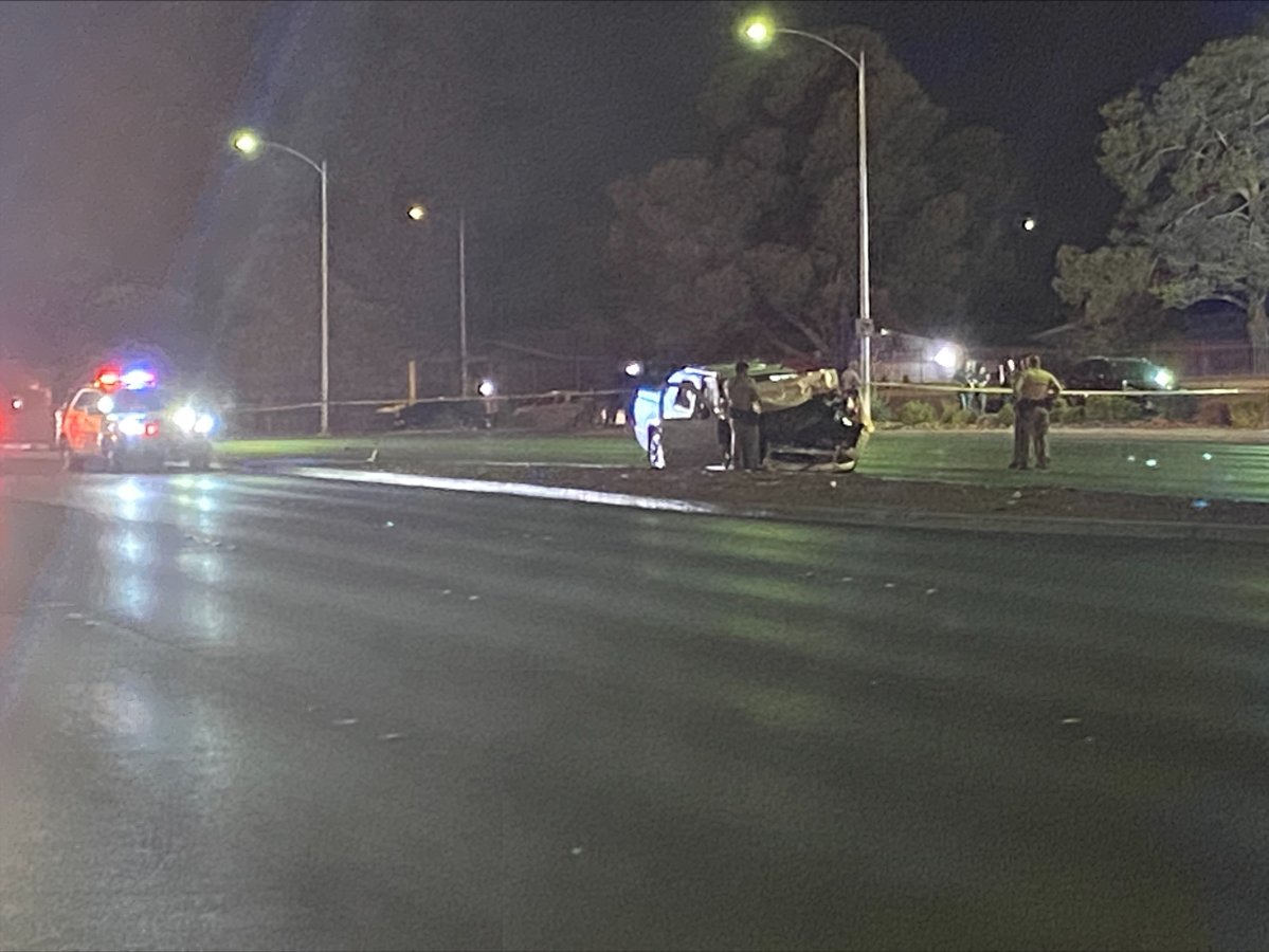 A wrecked pickup truck can be seen where police took a suspect in an officer-involved shooting into custody, near Charleston & Decatur