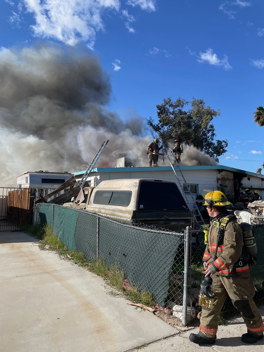 Fire crews respond to house fire near Harry Reid Airport, search for possible victims continues 