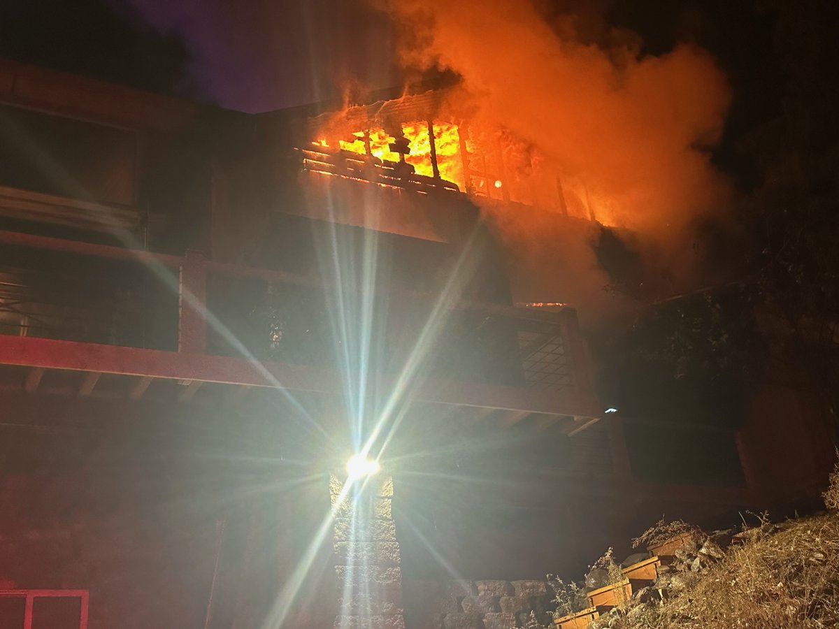 The roof of a Mt. Charleston home partially collapsed after catching fire Sunday night, firefighters say