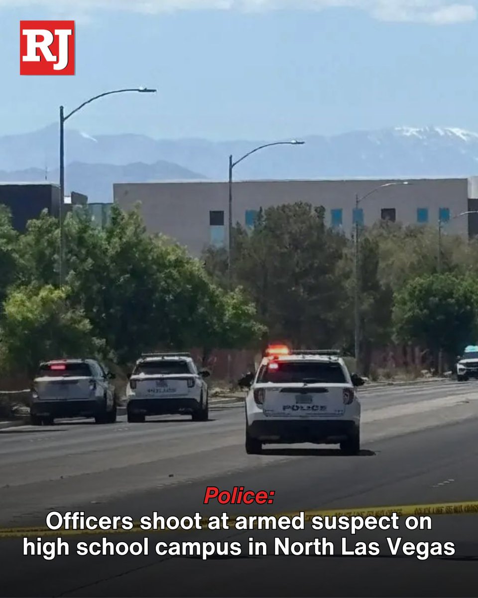 At least one officer opened fire after an armed man ran onto the Legacy High School campus in North Las Vegas on Thursday while classes were in session, police said